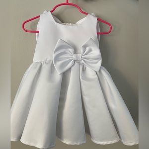 Baby flower girl dress with removable back bow and headband.
